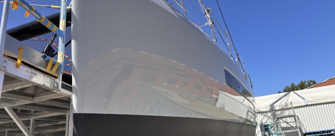 Yacht in shipyard with scaffolding during SEALS nanotech protective coating treatment