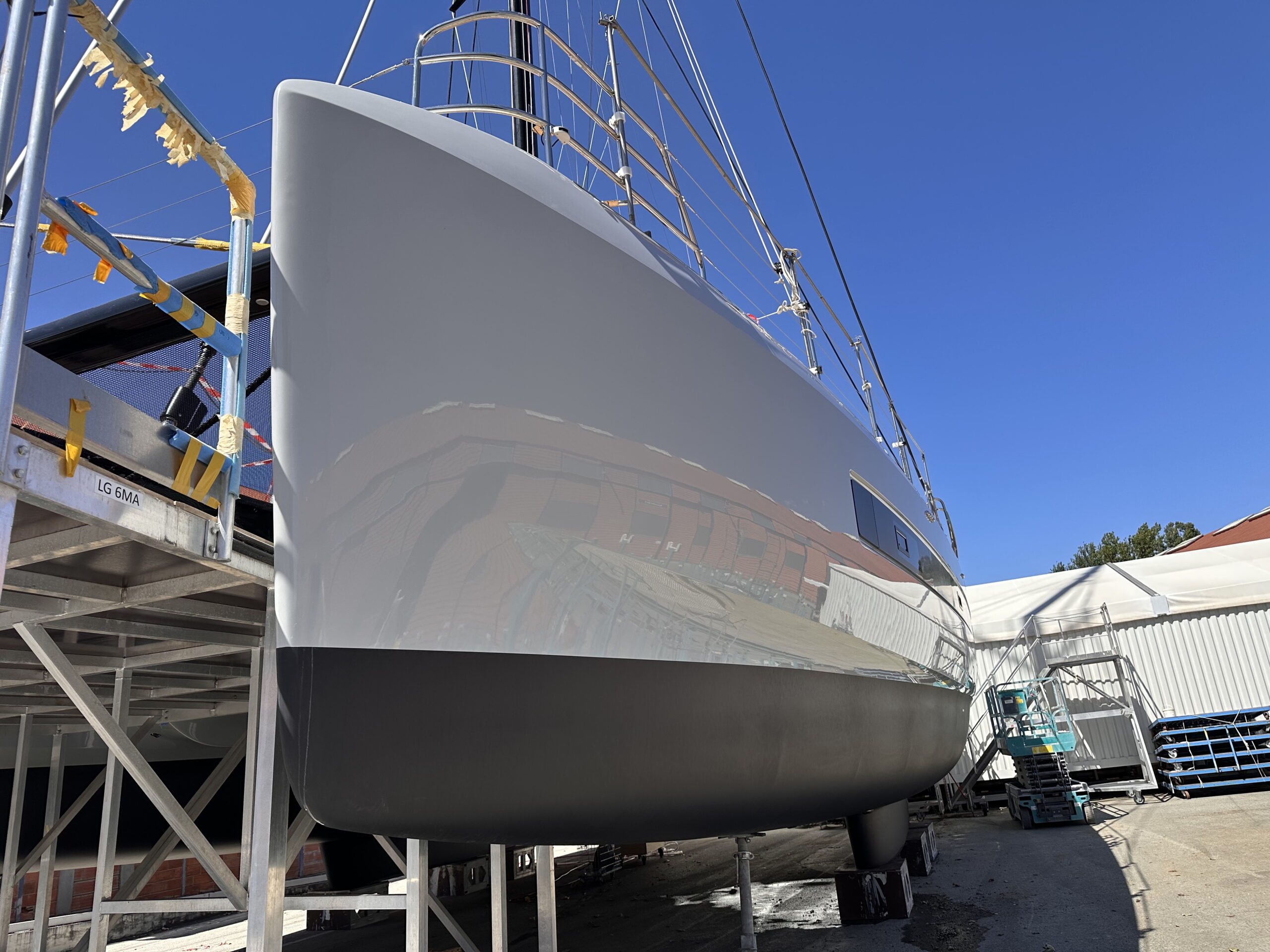 Yacht in shipyard with scaffolding during SEALS nanotech protective coating treatment